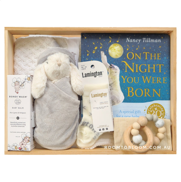 ROOM TO BLOOM Under the Stars Baby Gift Hamper set with plush toy, book, and rattle in a wooden box.