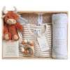 ROOM TO BLOOM Up, Up and Away Baby Gift Hamper set with plush toy, clothing, and baby items in a wooden box.