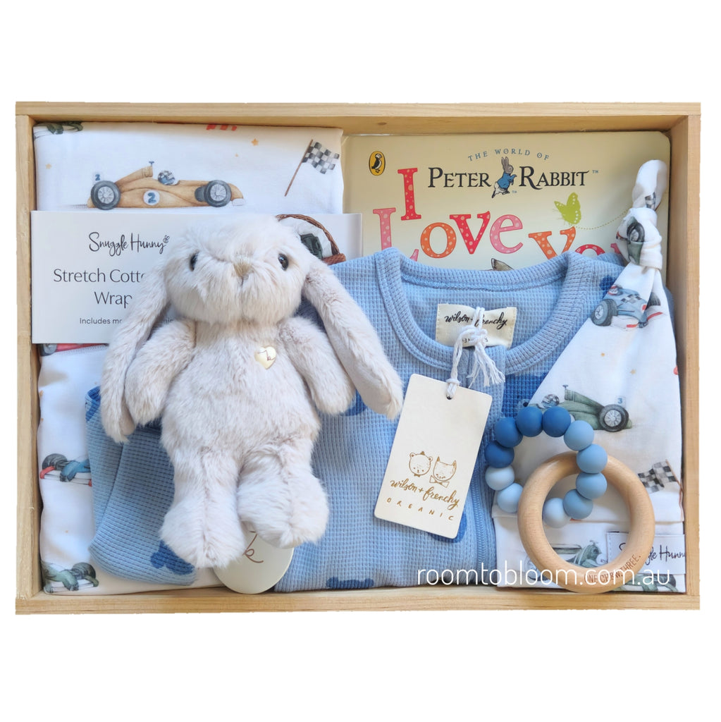ROOM TO BLOOM Vroom Vroom Baby Gift Hamper set with plush toy, baby clothing, teething ring and more in a wooden box.