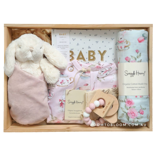 ROOM TO BLOOM White Rabbit Baby Gift Hamper set with plush toy, baby book, and other items in a wooden box.