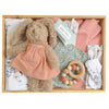 ROOM TO BLOOM Willow Baby Gift Hamperset arranged in a wooden box, featuring a plush bunny in a peach dress, pink knit blanket, floral baby swadle and headband, a wooden bead teether, and bib.