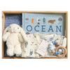 ROOM TO BLOOM Winter Whales Baby Gift Hamper set with plush toy, baby clothes, and more in a wooden box.
