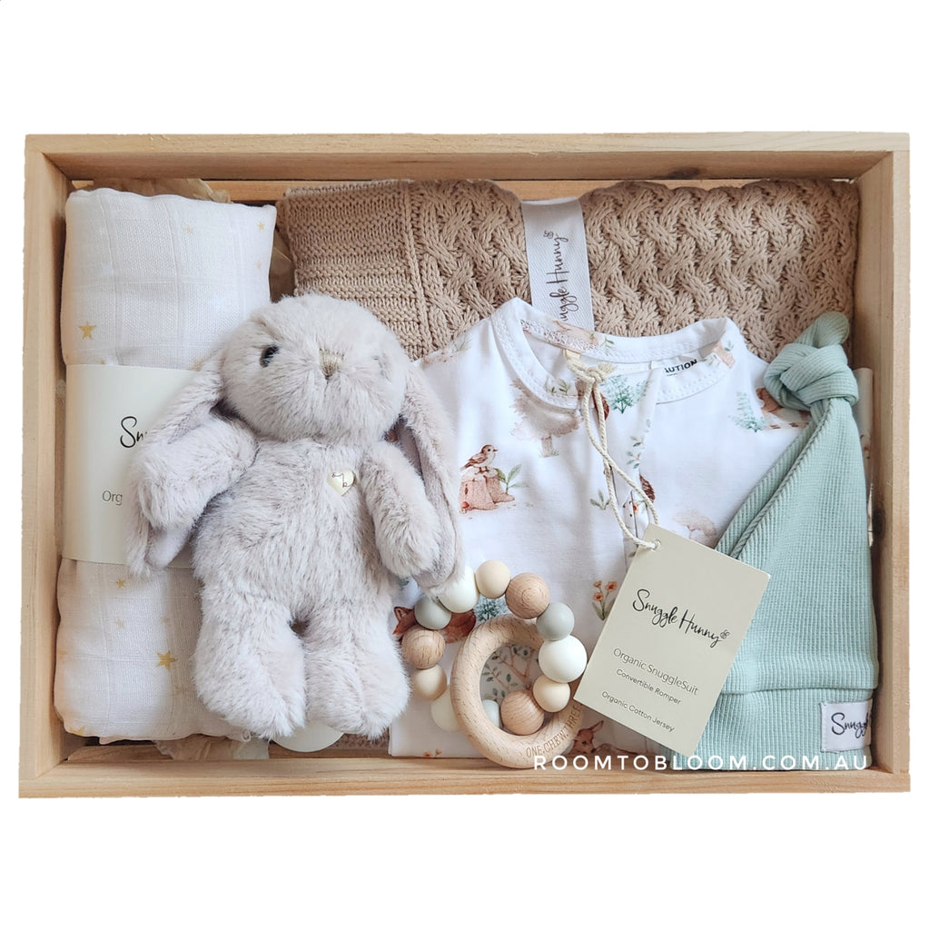 ROOM TO BLOOM Wonderful World Baby Gift Hamper set with plush toy, clothing, a blanket and more in a wooden box.