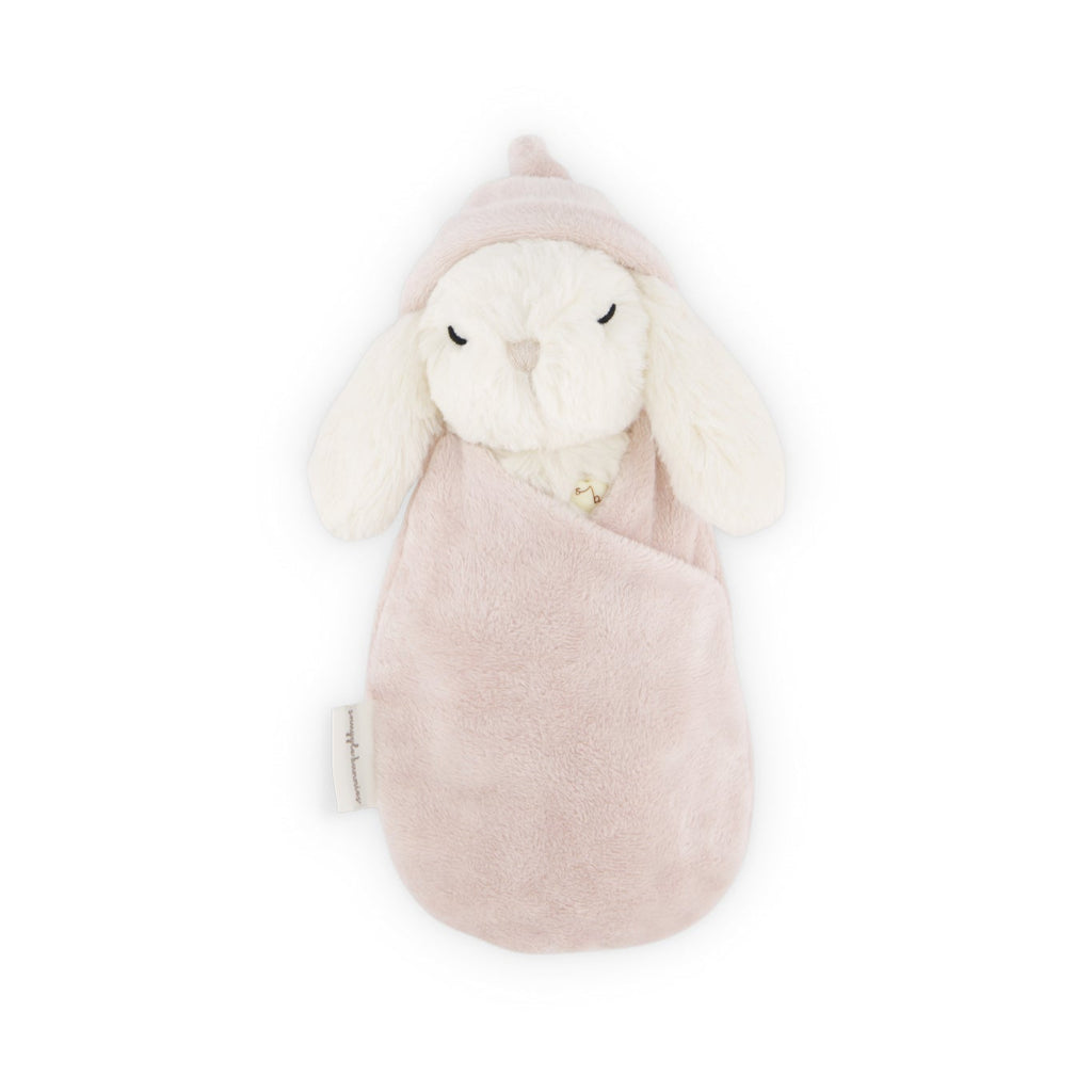 SNUGGLE BUNNIES Sleeping Penelope - Blush in a pink pouch on a white background